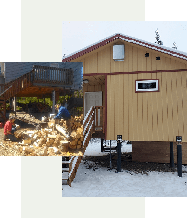 Wooden House and Two man Cutting Wood logs